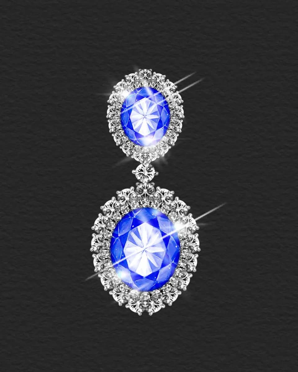 Sapphire drop earring surrounded by diamonds